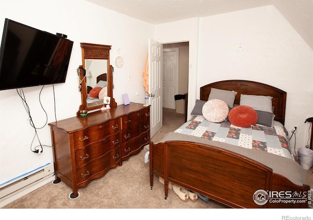 carpeted bedroom with a baseboard heating unit