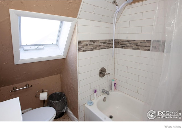 bathroom with toilet and shower / tub combo