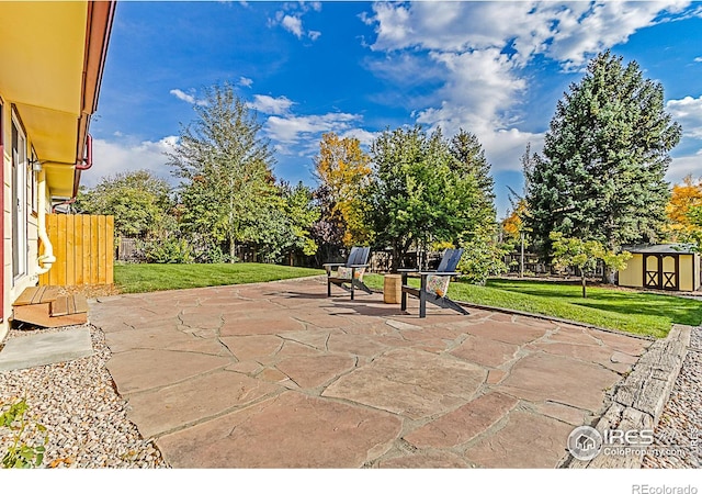 view of patio / terrace with a shed