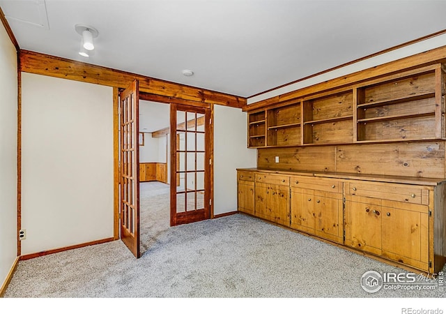 kitchen with french doors and light colored carpet