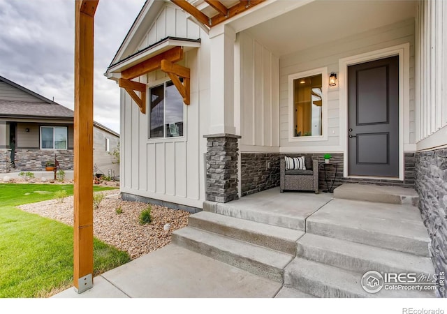 view of exterior entry with a porch