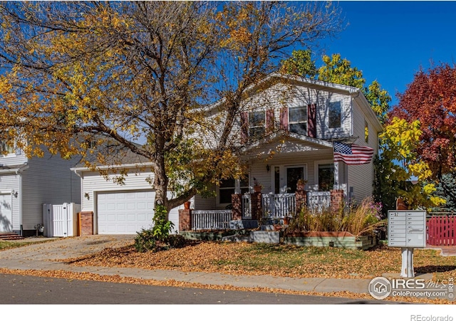 view of front of home featuring a porch and a garage