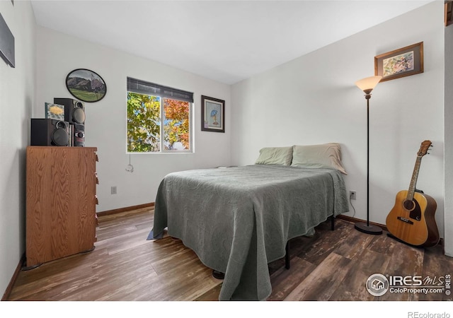 bedroom featuring hardwood / wood-style flooring