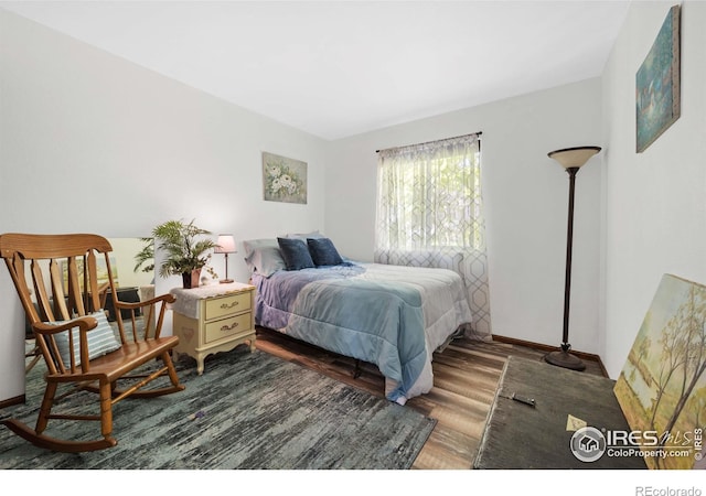 bedroom featuring dark hardwood / wood-style floors