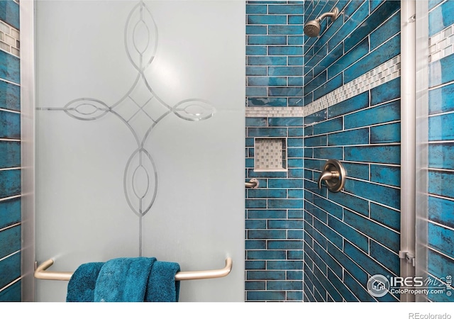 bathroom with tiled shower