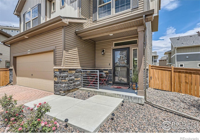 doorway to property featuring a garage