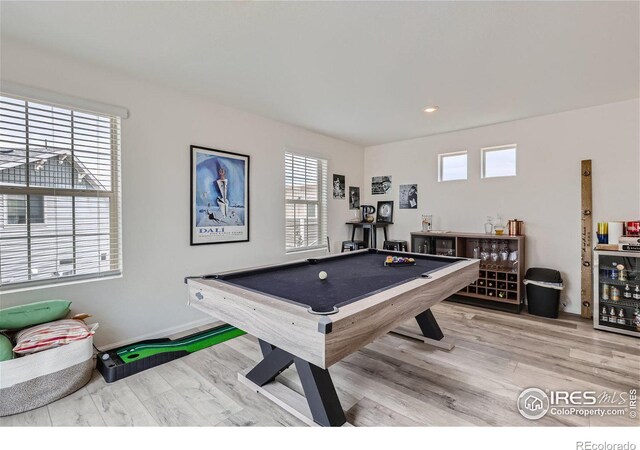 recreation room featuring wine cooler, wood-type flooring, and billiards