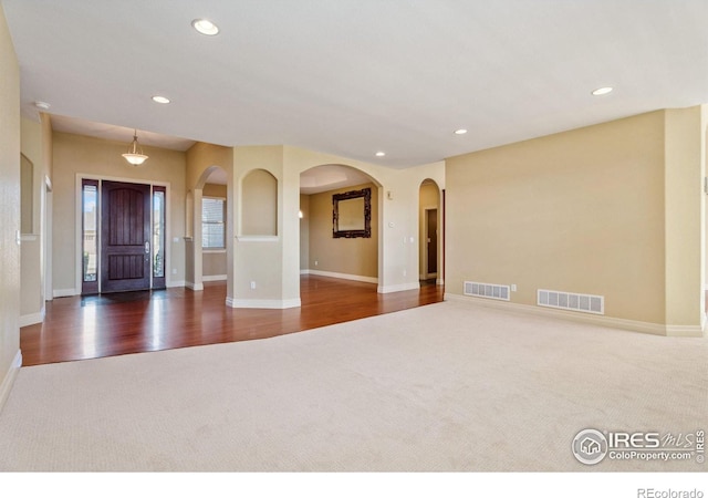 entrance foyer featuring dark hardwood / wood-style flooring