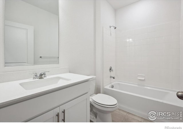 bathroom with shower / bath combination, vanity, toilet, and tile patterned floors