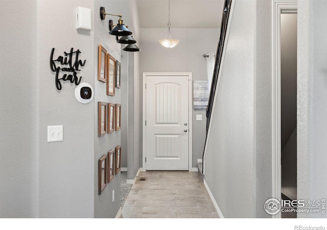 hall with light hardwood / wood-style flooring