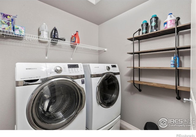 laundry area with independent washer and dryer