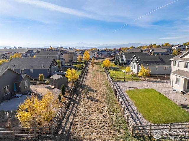 birds eye view of property featuring a mountain view