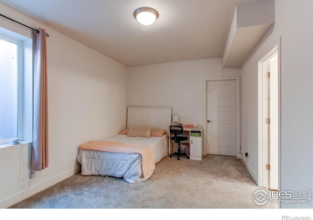 bedroom with light carpet