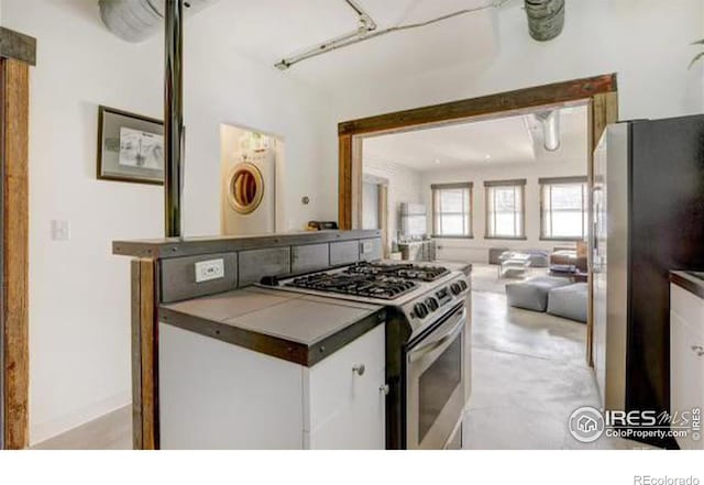 kitchen with white cabinetry and stainless steel appliances