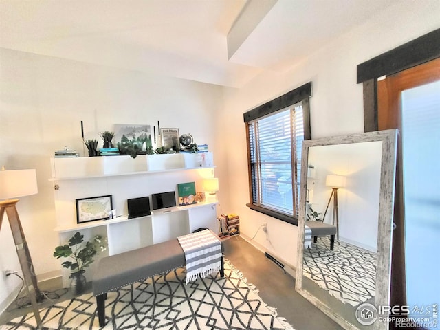 living area featuring concrete floors