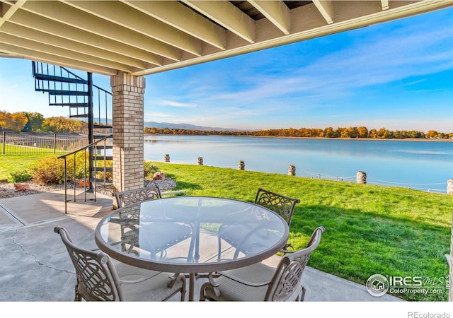 view of patio featuring a water view