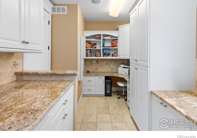 home office with light tile patterned flooring