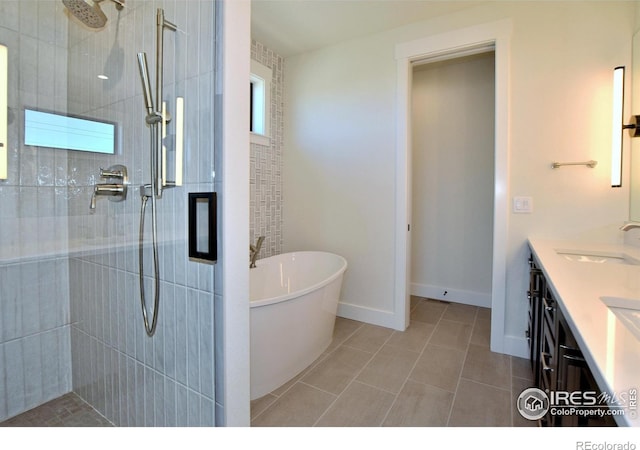 bathroom featuring tile patterned floors, vanity, and separate shower and tub