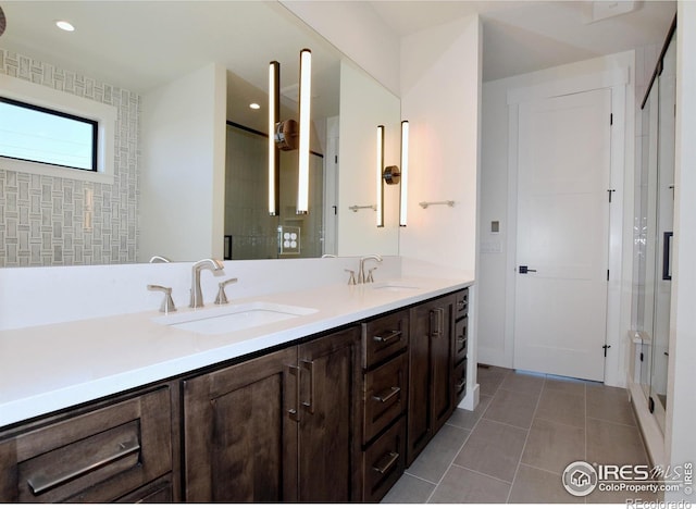 bathroom with tile patterned flooring and vanity