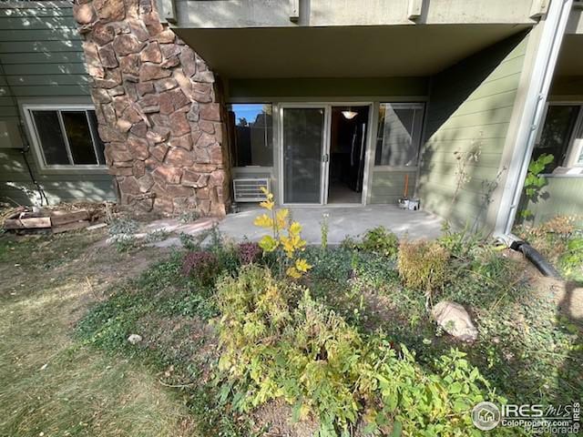 3345 Chisholm Trl Unit 105C, Boulder, CO 80301 - doorway to property featuring stone siding