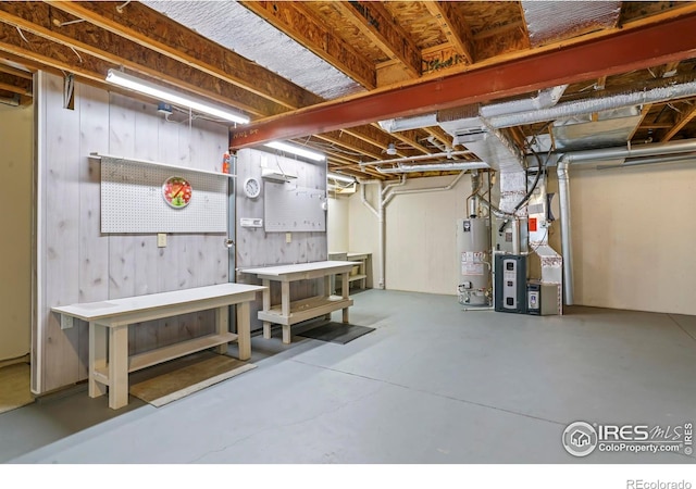 236 Remuda Ln, Lafayette, CO 80026 - unfinished basement featuring a workshop area, heating unit, and gas water heater