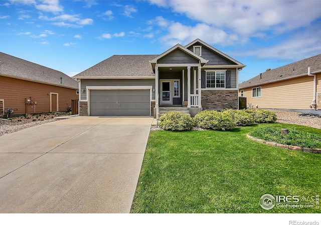 craftsman-style home with a garage and a front lawn