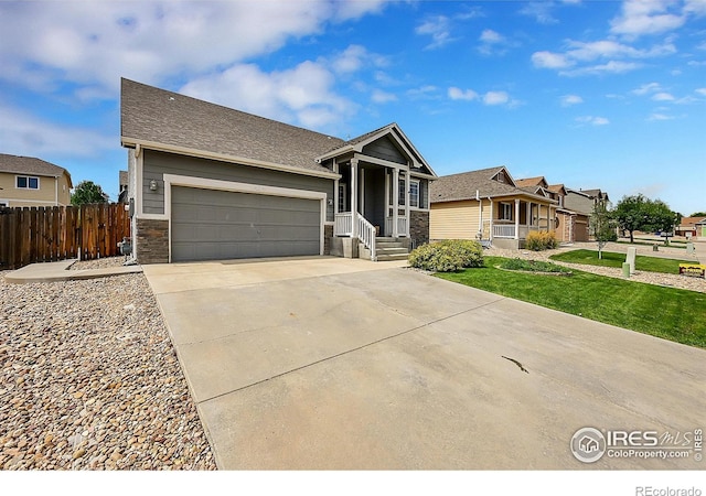 view of front facade with a front yard and a garage