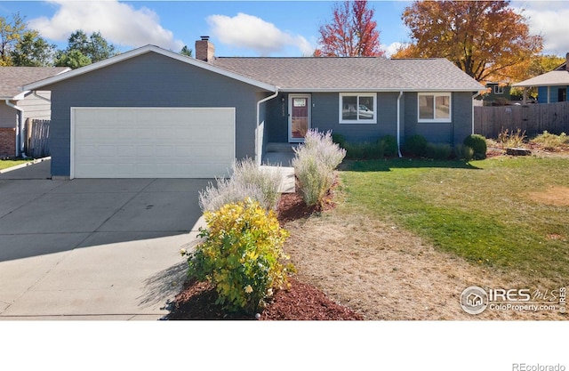 single story home with a front yard and a garage