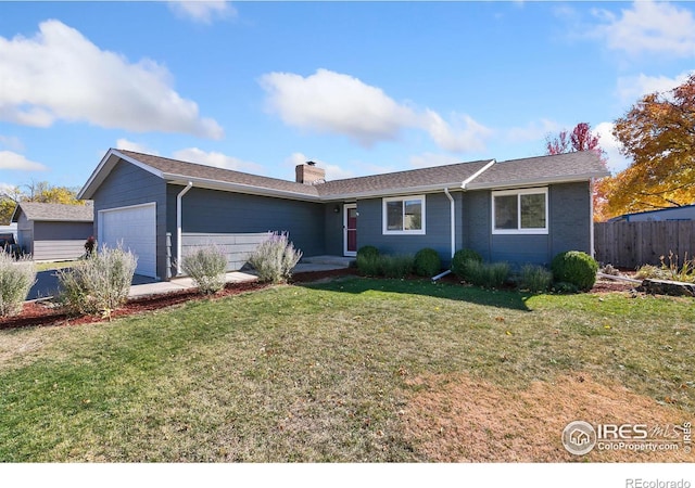 single story home with a front lawn and a garage