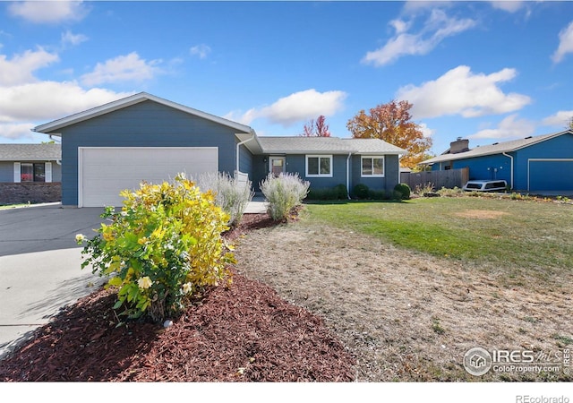 ranch-style home with a front yard and a garage