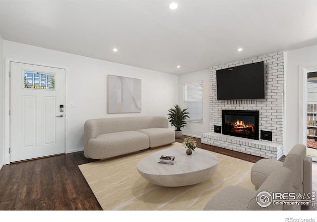 living room featuring hardwood / wood-style floors and a fireplace