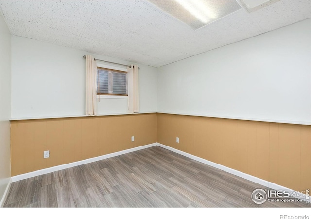 unfurnished room featuring hardwood / wood-style floors