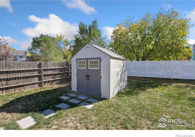 view of outbuilding with a lawn