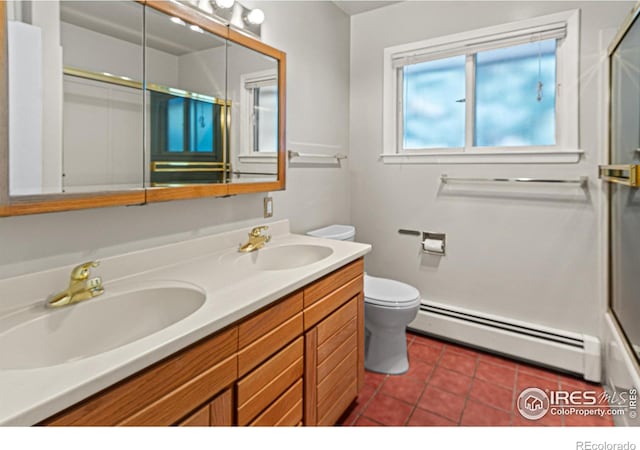 bathroom featuring baseboard heating, tile patterned floors, toilet, and vanity