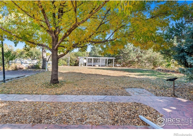 view of yard with a pergola