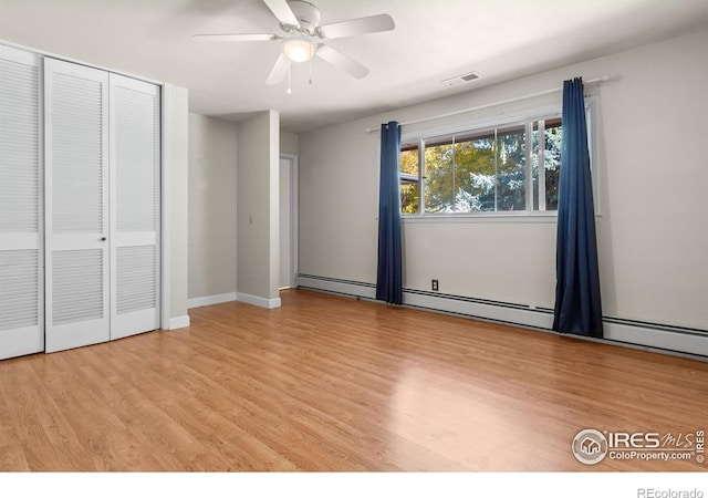 unfurnished bedroom with ceiling fan, a closet, and light wood-type flooring