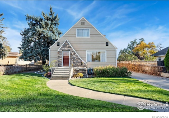 view of front of property with a front lawn