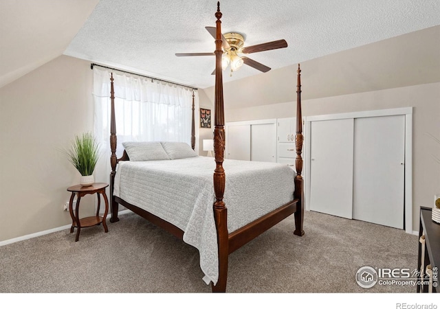 bedroom featuring lofted ceiling, a textured ceiling, carpet floors, and ceiling fan