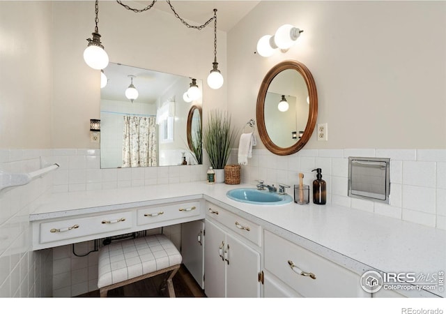 bathroom featuring vanity and tasteful backsplash