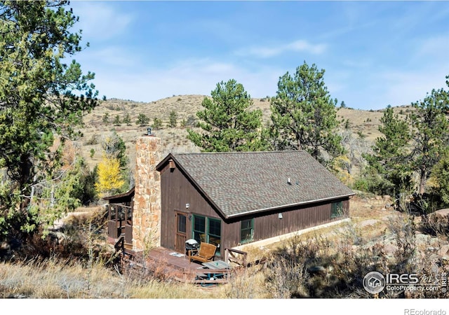 view of home's exterior with a mountain view