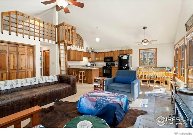 living room with high vaulted ceiling and ceiling fan