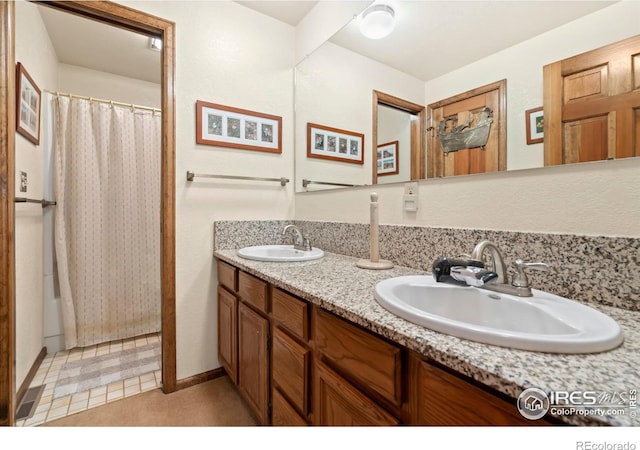 bathroom with vanity and a shower with curtain