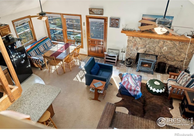 living room featuring lofted ceiling and ceiling fan