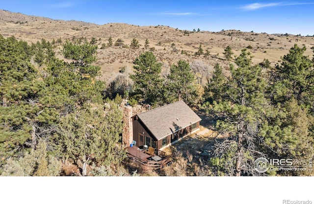 birds eye view of property featuring a mountain view