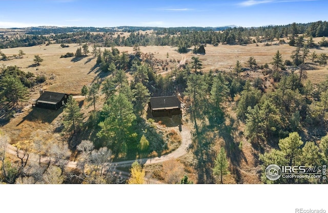 birds eye view of property featuring a rural view