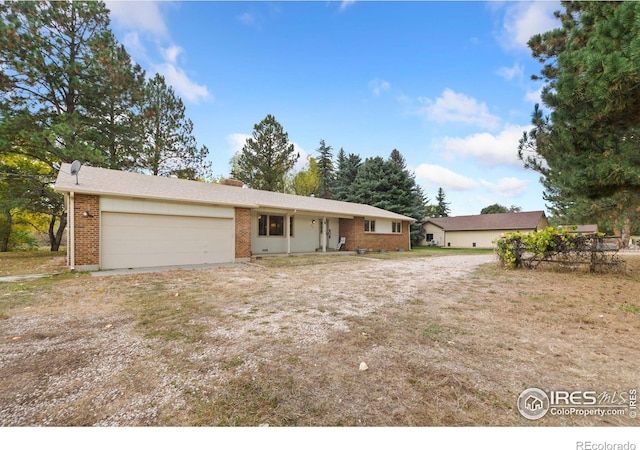 ranch-style home featuring a garage