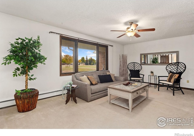 carpeted living room with ceiling fan, a baseboard heating unit, and a textured ceiling