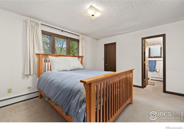 carpeted bedroom featuring a textured ceiling and baseboard heating