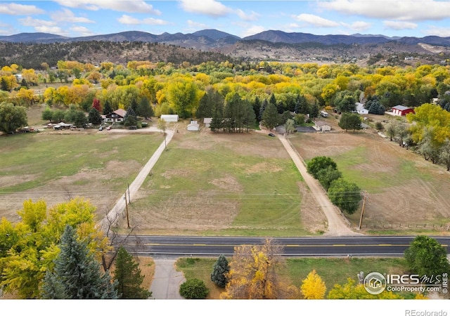 bird's eye view featuring a rural view and a mountain view