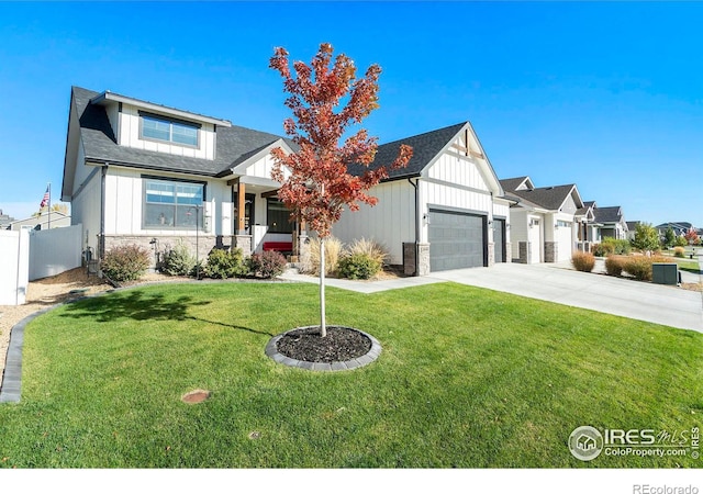 view of front of house with a garage and a front lawn